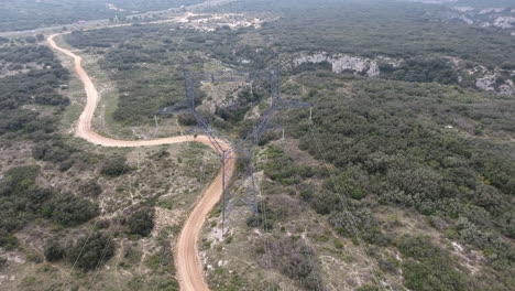 Aerial-view-of-high-voltage-power-line-in-garrigue--France.